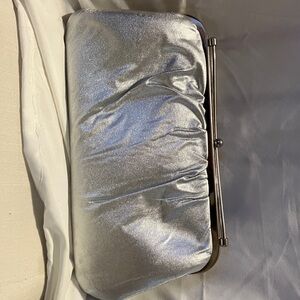 NEW.  Fairly large , gorgeous silver shimmer clutch bag in perfect condition